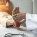 Plantar Fasciitis or heel pain illness in feet of woman patient who having medical exam with orthopaedic doctor on aching tendon Royalty Free Stock Photo