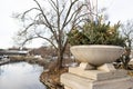 Planter with Pine Branches over the DuPage River along the Naperville Riverwalk during Winter