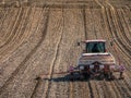 Planter sowing arable field with corn seeds