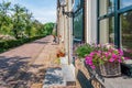 Planters with flowering plants in the windowsills of historic houses Royalty Free Stock Photo