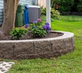 Planting bed surrounded by block retaining wall