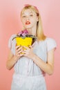 Planting flowers.Gardener woman planting flowers. Cute blonde gardening at background. Royalty Free Stock Photo