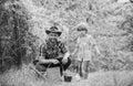 Planting flowers. Growing plants. Take care of plants. Boy and father in nature with watering can. Gardening tools. Dad Royalty Free Stock Photo