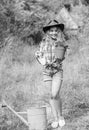 Planting plants. Little kid hold flower pot. Spring country works. Happy childrens day. Happy childhood. Child in hat Royalty Free Stock Photo