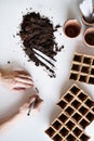 Planting seeds composition. Female hands writing on plant labels.