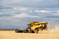 A large combine harvesting an Idaho wheat field.