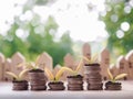 Plants growing up on stack of coins Royalty Free Stock Photo