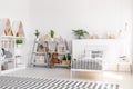 Plants and plush toy on shelves in scandi child`s bedroom interi Royalty Free Stock Photo