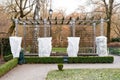 Plants and trees in a park or garden covered with blanket, swath of burlap, frost protection bags or roll of fabric