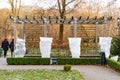 Plants and trees in a park or garden covered with blanket, swath of burlap, frost protection bags or roll of fabric