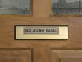 A plaque on the front door with a request not to advertise in the mailbox.