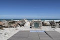 Plaque at southernmost point of Africa against Atlantic Ocean and Indian Ocean at Cape Agulhas