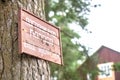 A plaque on a tree. Russian text: Border strip. Entrance prohibited