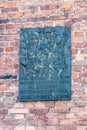 Plaque in tribute to scout and political prisoners in Auschwitz concentration camp Royalty Free Stock Photo