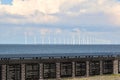 Plaques with the names of Urk fishermen who died at sea and the wind farm behind them