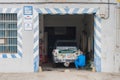 Plasencia, Caceres, Spain - December 01, 2014: Worker painting a car