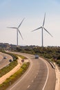 A pair of windmills in the Sierra del Merengue wind farm next to the Ruta de la Plata highway passing through Plasencia.