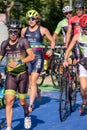 Fitness athletes pedaling their bikes during a national Triathlon, swimming, cycling and running events.