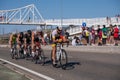 Fitness athletes pedaling their bikes during a national Triathlon, swimming, cycling and running events.