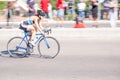 Fitness athletes pedaling their bikes during a national Triathlon, swimming, cycling and running events.