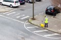 PLASENCIA, SPAIN - January 08, 2021: A surveyor takes measurements in the street with an optical level and laser Royalty Free Stock Photo