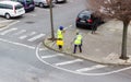 PLASENCIA, SPAIN - January 08, 2021: A surveyor takes measurements in the street with an optical level and laser Royalty Free Stock Photo