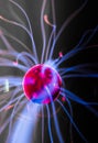 Plasma ball with magenta-blue flames Royalty Free Stock Photo