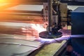 Plasma cut machine cutting steel sheet with sparks. Lasercutting of industrial iron works