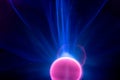 Plasma electric ball lightning lamp. Fascinating space video close-up of electrical discharges with blue flames on a dark