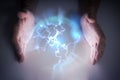 Plasma or electric lightning around hanbds of magician. Royalty Free Stock Photo