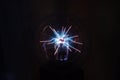 Plasma globe glass lamp ball in action . Fun blue and pink neon light effect with black background . Science Experiment . Royalty Free Stock Photo