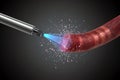 Plasma torch treating a red object with a textured surface Royalty Free Stock Photo