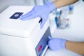 Plasmolifting. Preparation of blood for injections. cosmetologist puts tube of blood in centrifuge Royalty Free Stock Photo