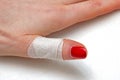 Plaster band aid on human finger Royalty Free Stock Photo