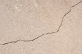 Plaster floor with cracks. Building requiring repair closeup. Royalty Free Stock Photo