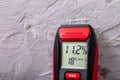 Plaster moisture measurement using an electronic meter. Measurements in the home workshop Royalty Free Stock Photo