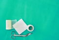 Plaster ,net bandage ,gauze and scissors for dressing clean wound on medical background with copy space ,flat lay Royalty Free Stock Photo