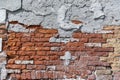 Plaster peeling from an old red brick wall. Worn out building in Venice Royalty Free Stock Photo