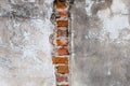 Plaster and red brick wall damage. Royalty Free Stock Photo
