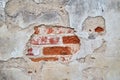 Plaster and red brick wall damage. Royalty Free Stock Photo