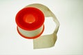 Plaster roll with white tape that is indispensable in a first aid kit.