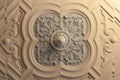 Plaster rosette with a geometric pattern on the ceiling of an ancient manor Royalty Free Stock Photo