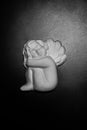 Plaster sculpture of little cherub.