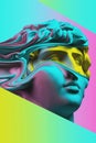 Plaster sculpture of young man face in a pop art style. Statue of Antinous head. Creative concept colorful neon image Royalty Free Stock Photo