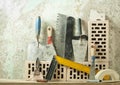 Construction tools in a row and bricks.Building and renovation concept.