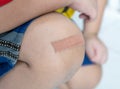 Plaster wound dressing on the child leg Royalty Free Stock Photo