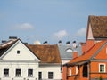 Plastered houses with a sloping tiled roof stand in the old quarter of pre-war time