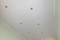 Plastered and painted ceiling in the room, with spotlights installed Royalty Free Stock Photo