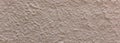 Plastered painted wall texture background, beige brown color, banner