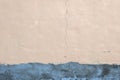 Plastered wall with a crack and fresh cement plaster underneath. Texture of old walls Royalty Free Stock Photo
